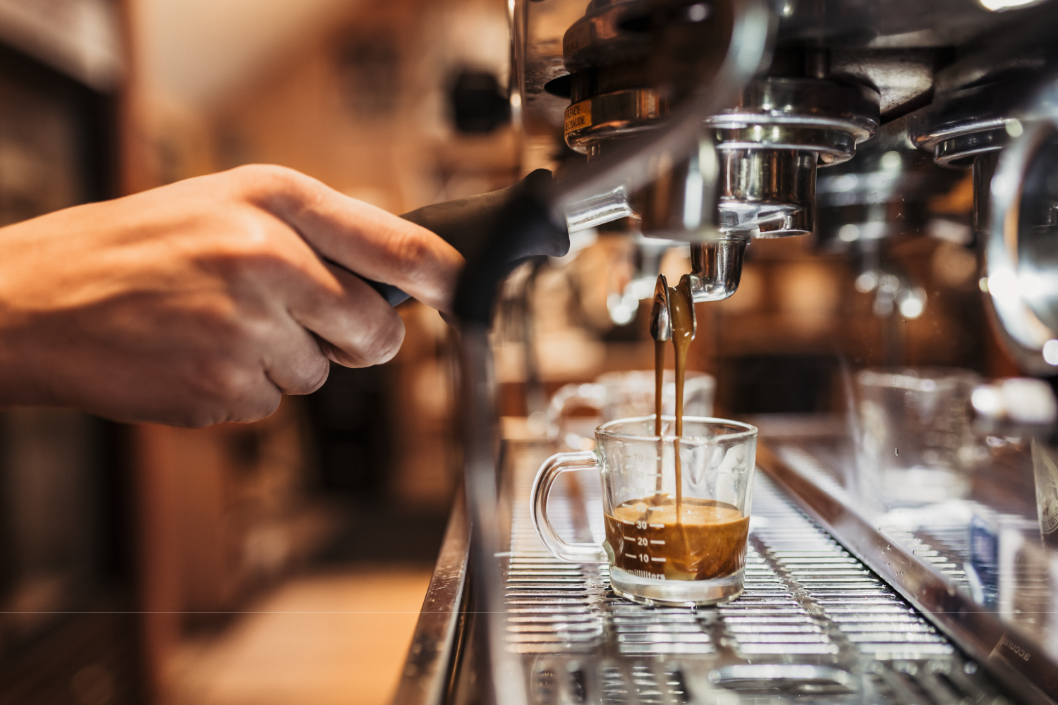 Coffee being extracted from an espresso machine