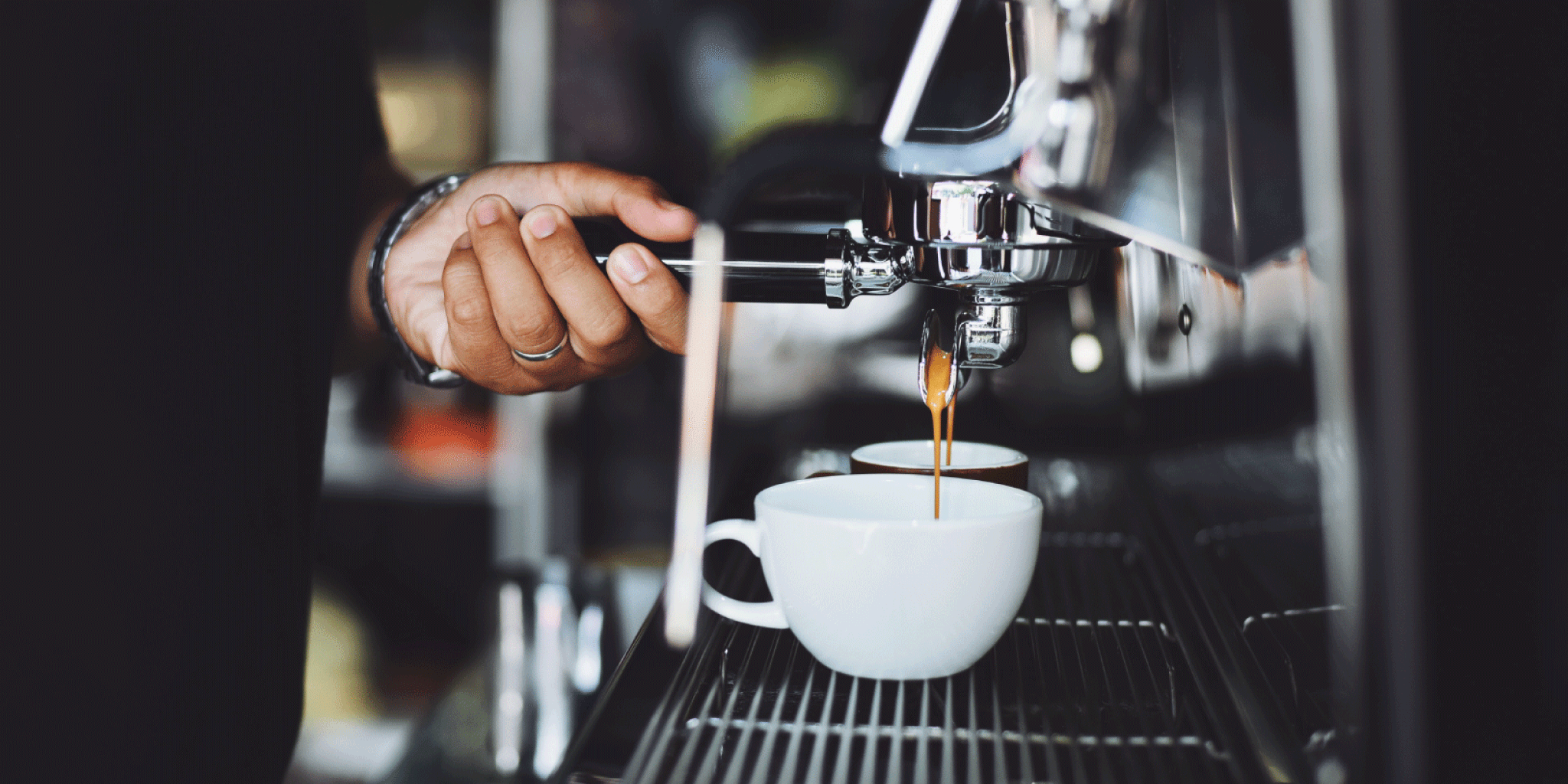 Coffee being extracted from an espresso machine