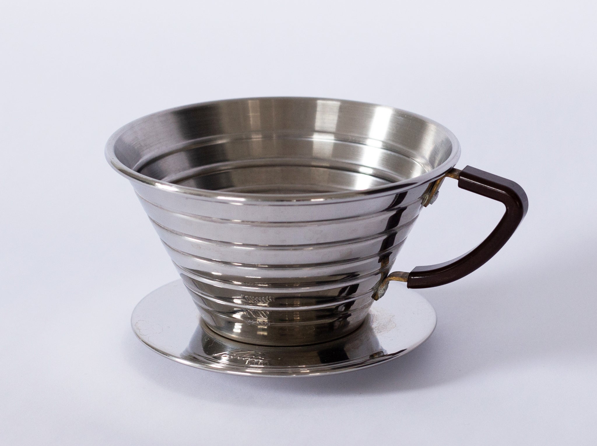 A steel coffee brewer on a white background