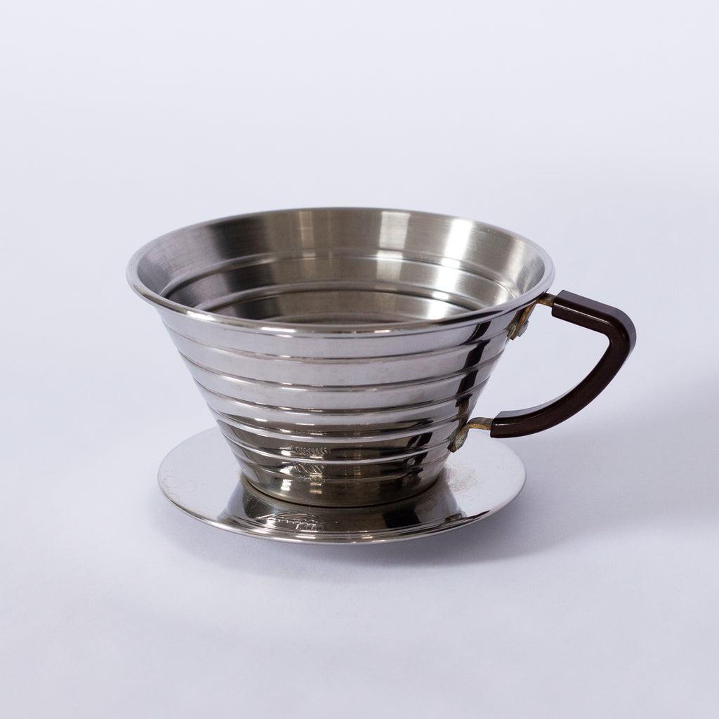 A steel coffee brewer on a white background